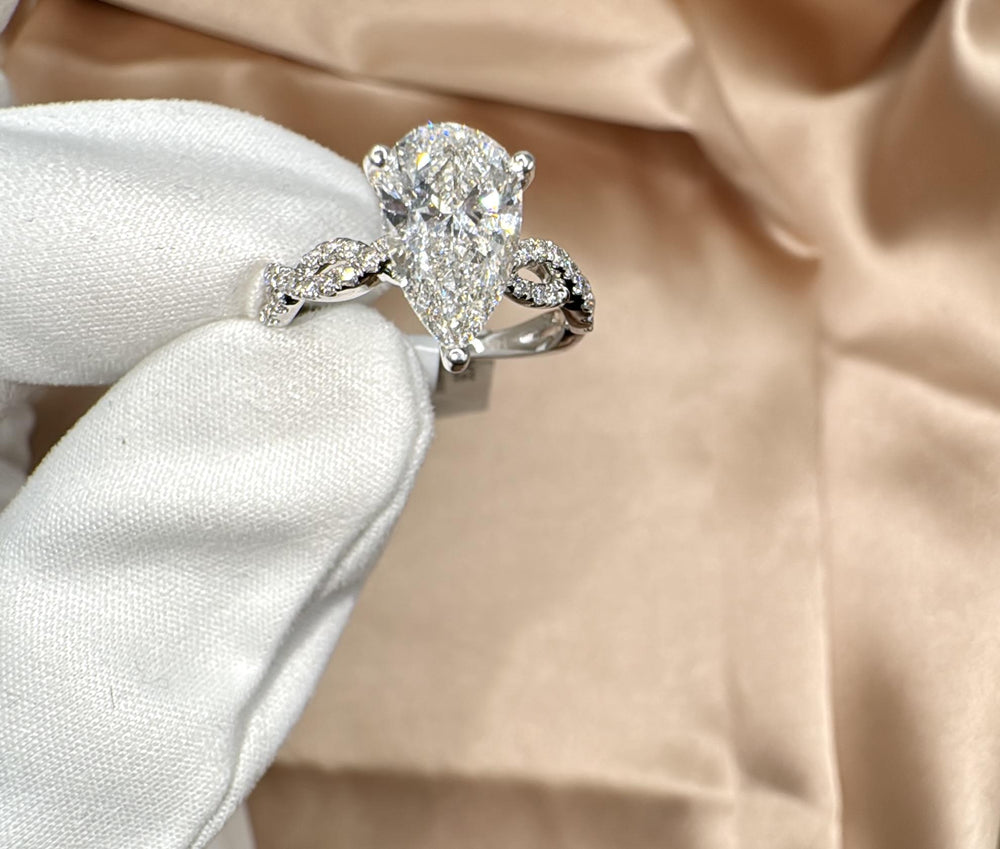 Buy Infinity Design Pear Cut Diamond Solitaire Ring Online